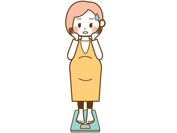 体重計に乗る妊婦のイラスト